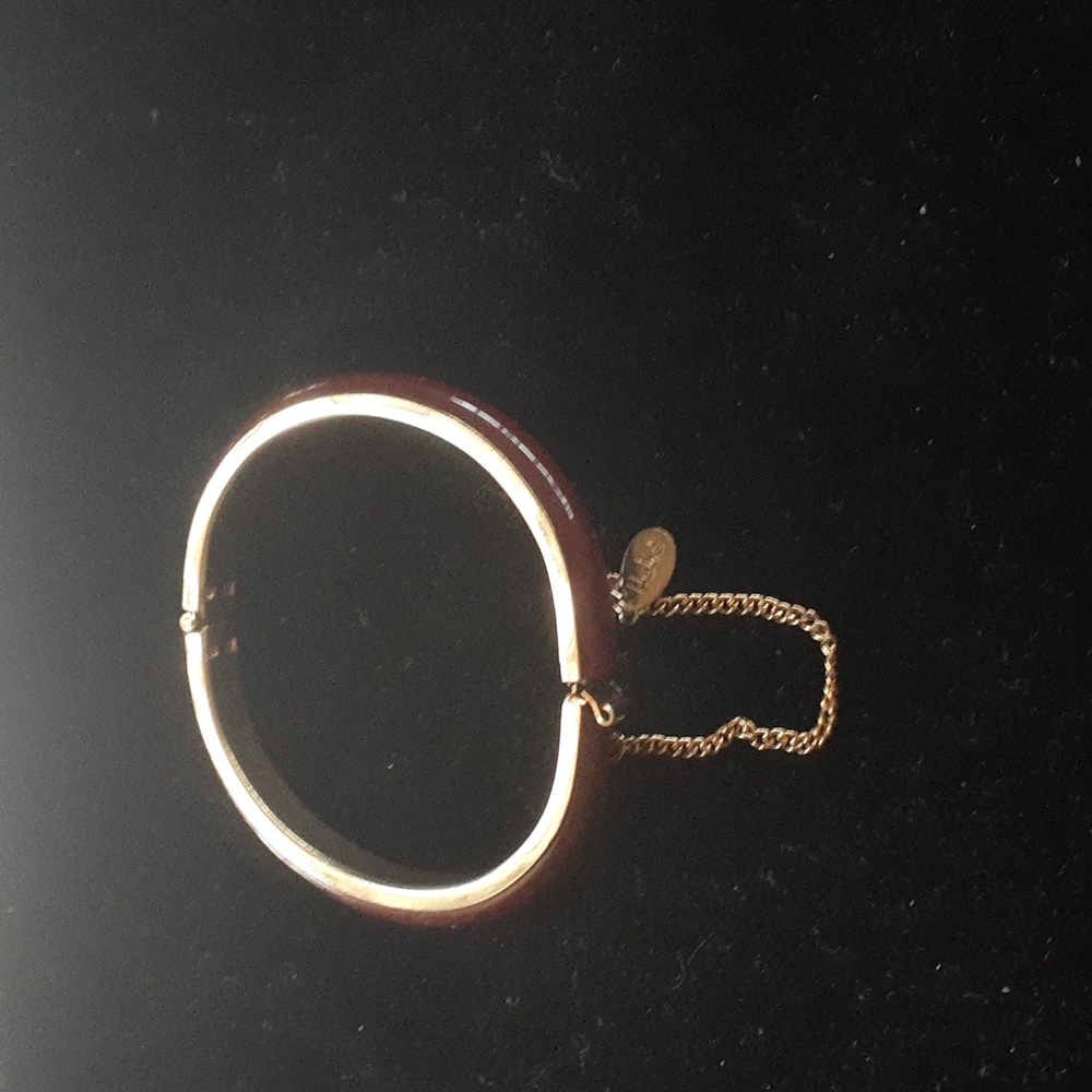 Vintage Hobé burgundy lucite, gold tone bangle bracelet.